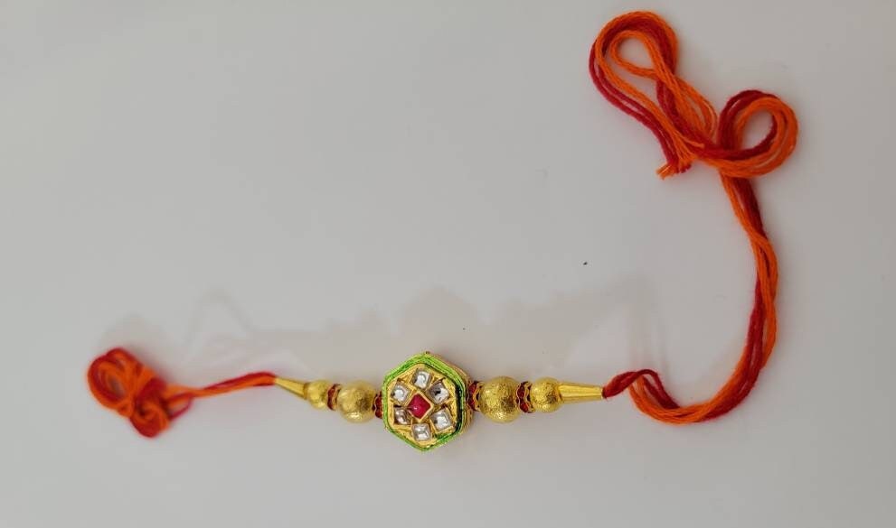 Beautiful rakhis with hanging charm, gold beads, iridescent blue acrylic beads |Indian rakhi| Lumba Rakshbandhan Rakhadi for brother