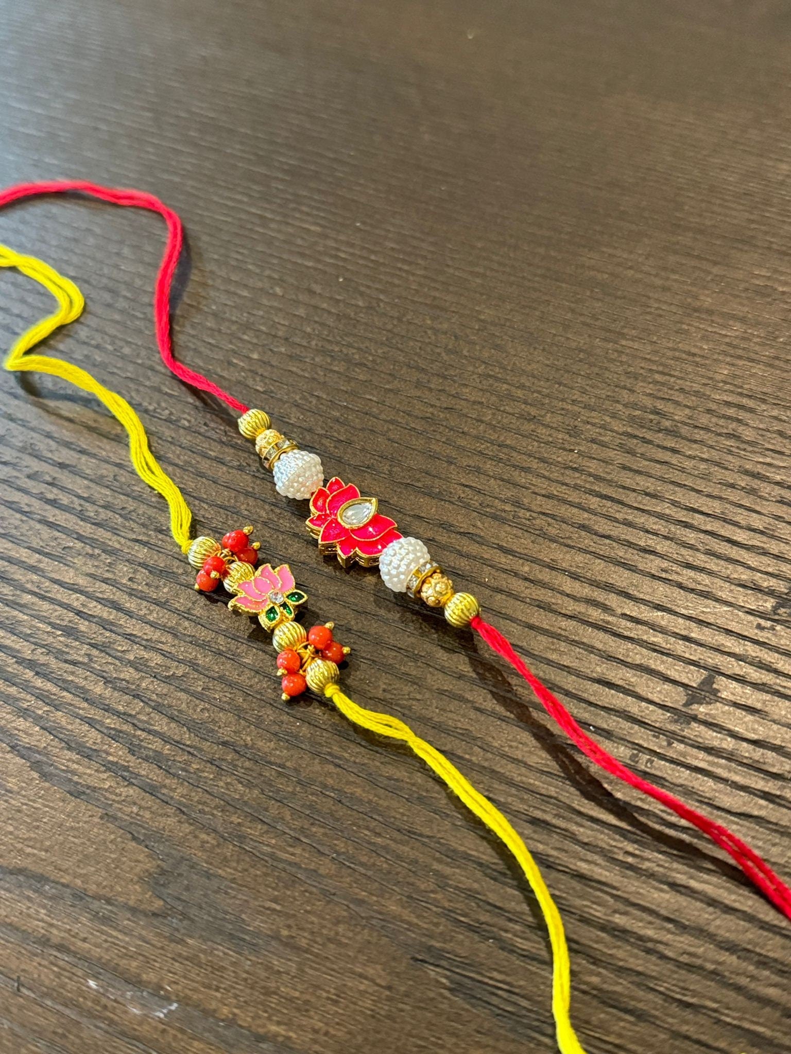 Beautiful rakhis with hanging charm, gold beads, pink and red lotus rakhi |Indian rakhi| Lumba Rakshbandhan Rakhadi for brother| Rakhdi